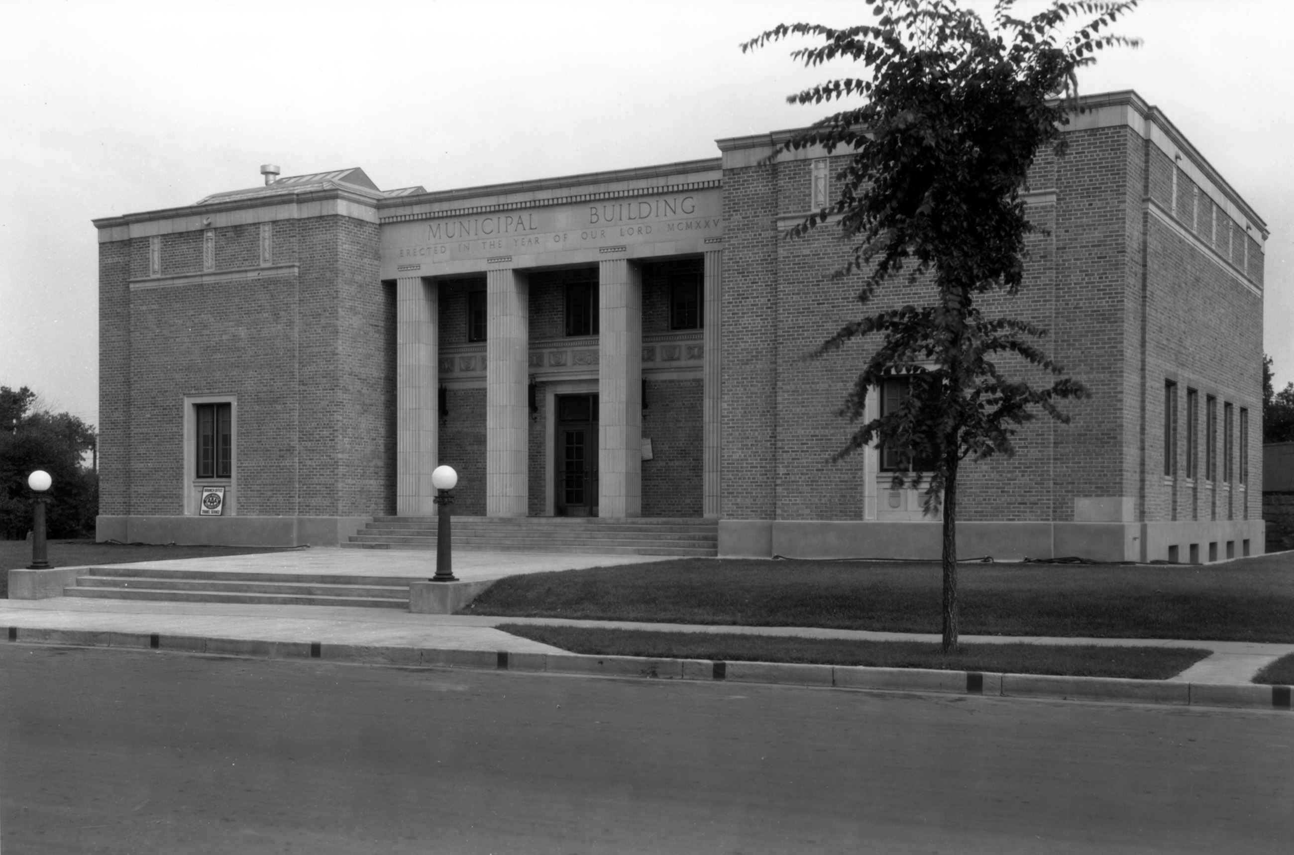 Black and white photo of municipal building circa 1935.  Photo taken from street view.