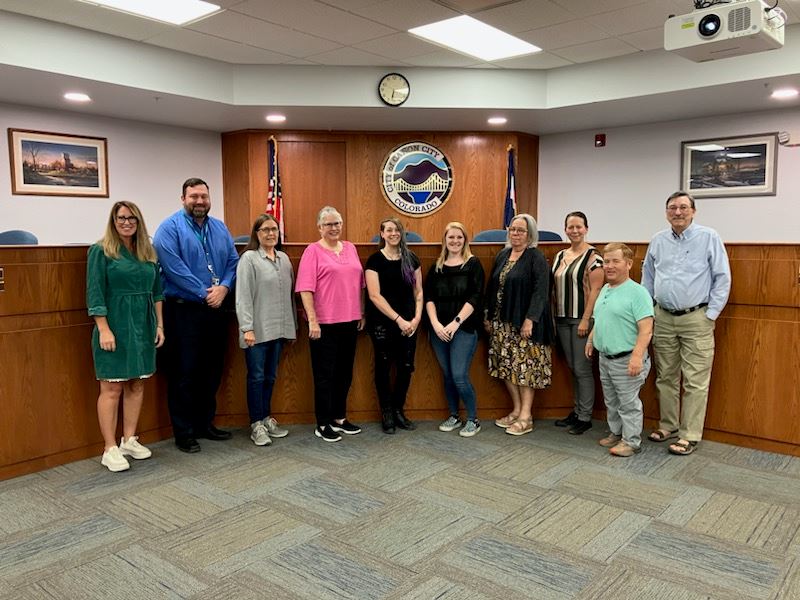 Photo of the Mayor, City Council, City Administrator, and artists Kayla Farber and Sydney Danielson