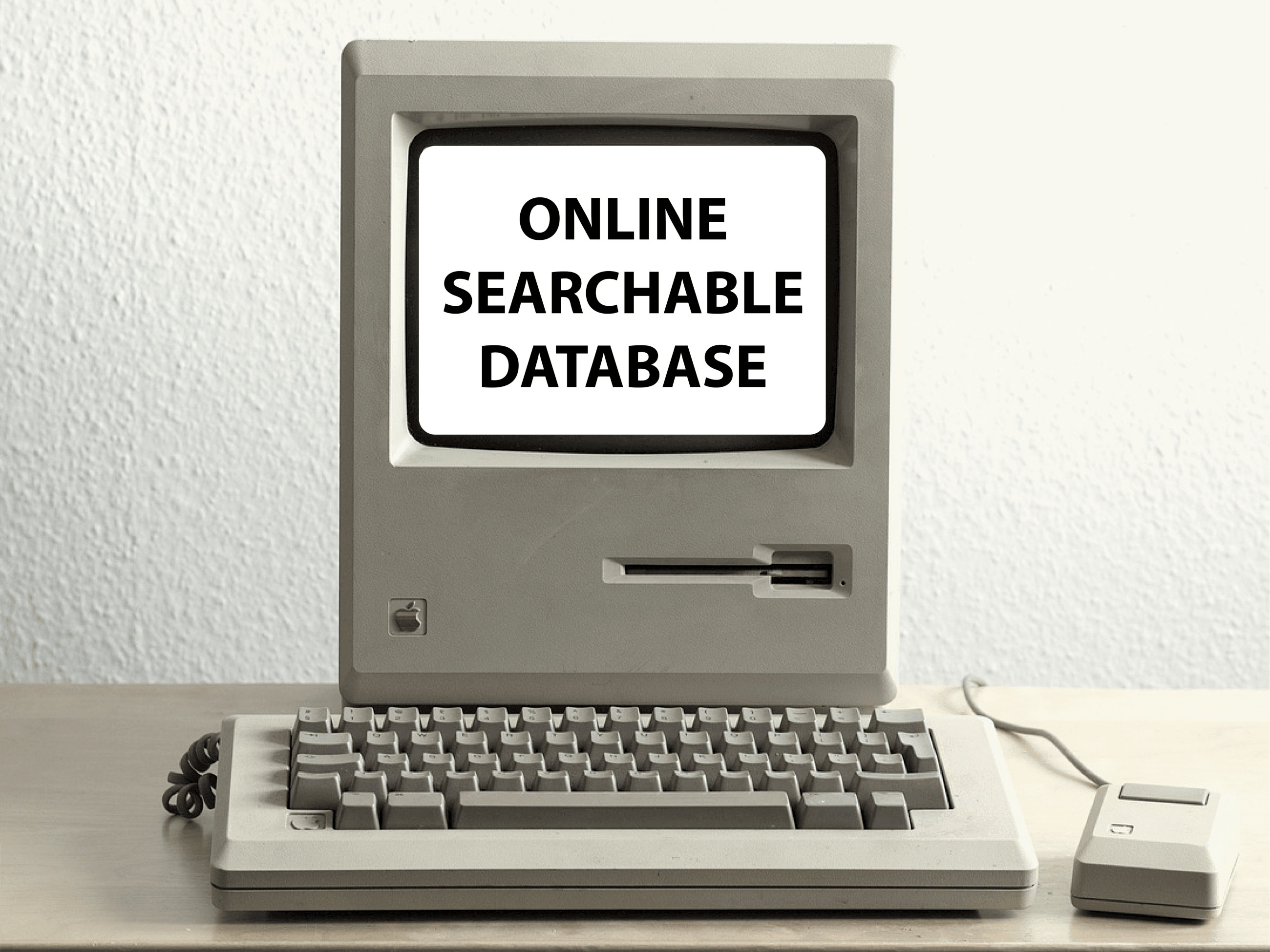 Image of an old Apple computer with mouse and keyboard.